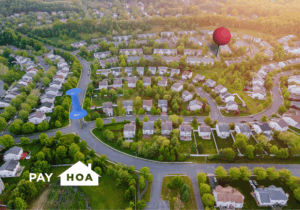 An aerial shot of a neighborhood with giant map pins stuck in the road as if to illustrate, "Property management companies near me"