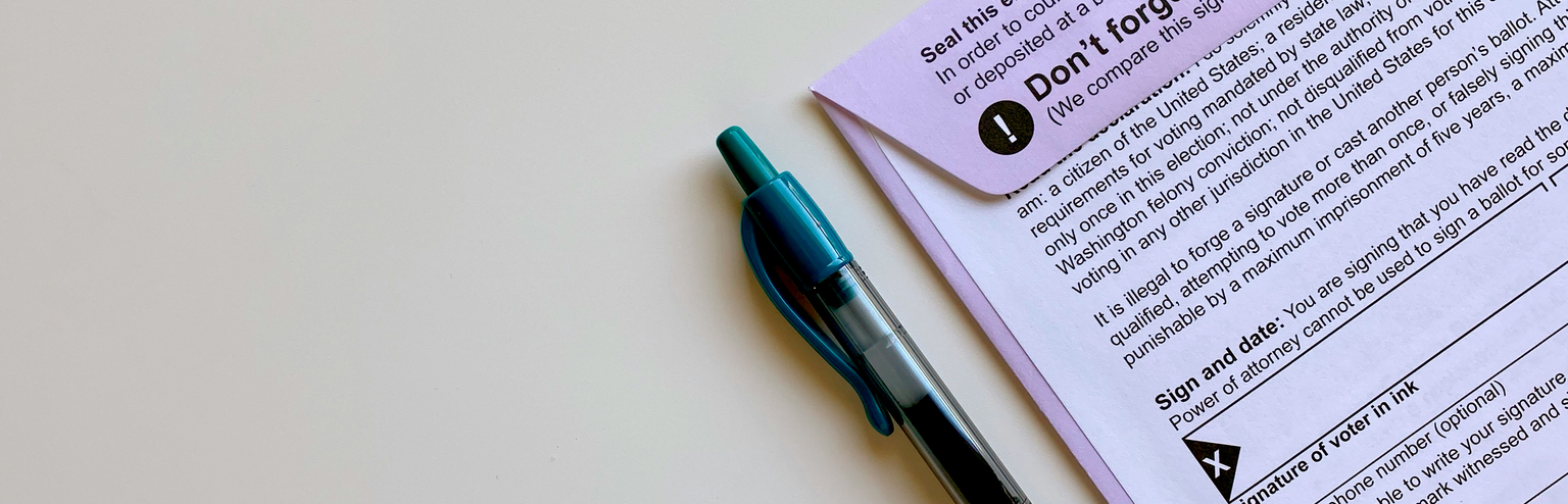 HOA voting ballot with envelope and pen