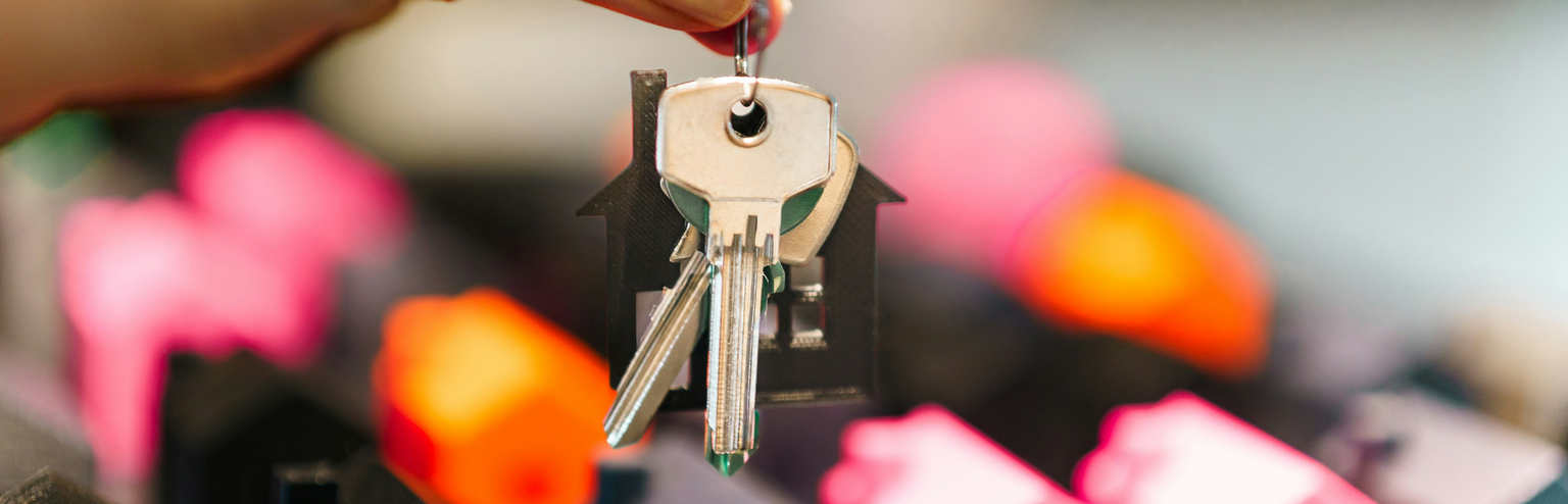 Keys to a rental property in an HOA neighborhood